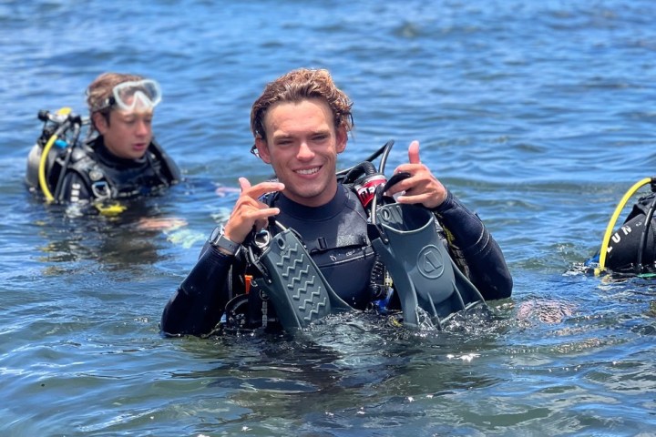 a group of people swimming in a body of water