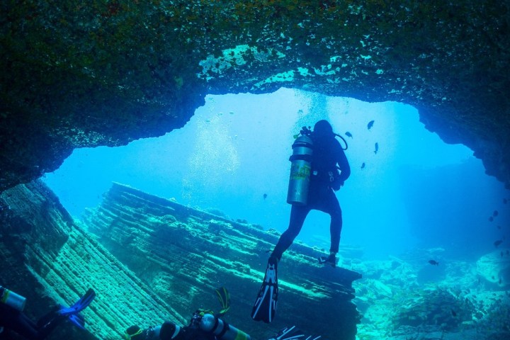 a man diving in the water