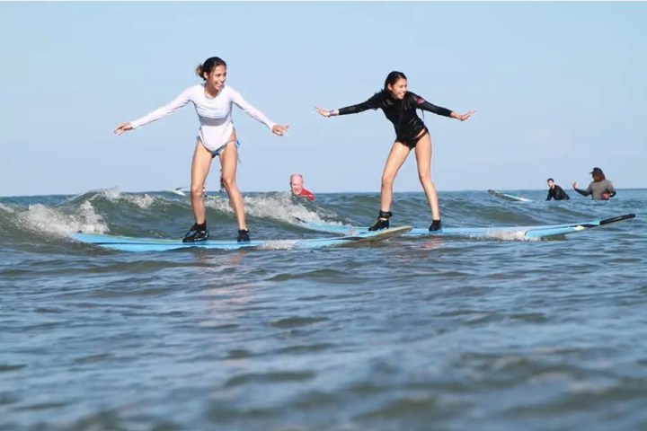 a person riding a wave on a surfboard in the water