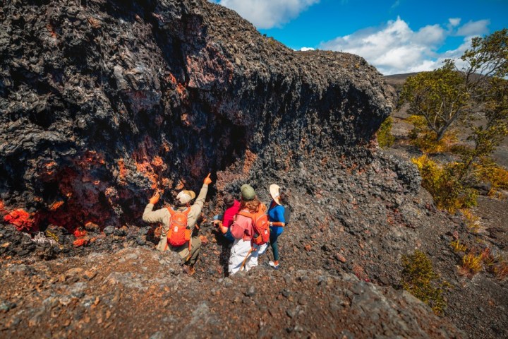 a man standing on a rocky hill