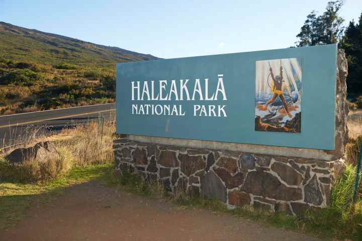 a sign on the side of a mountain