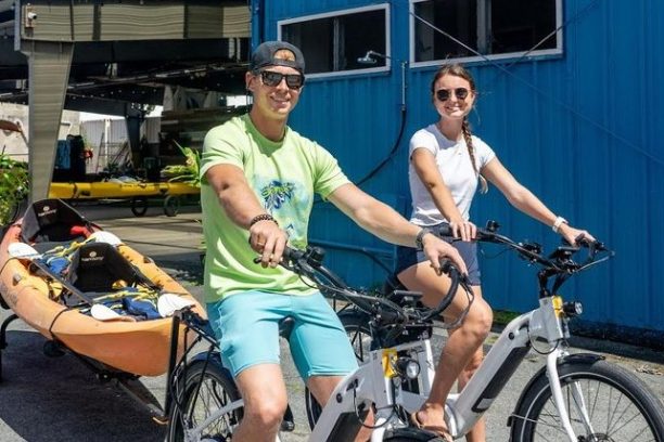 a person riding on the back of a bicycle