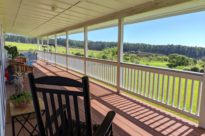 a dining room table in front of a fence