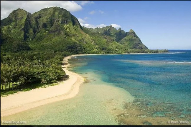 a body of water with a mountain in the background