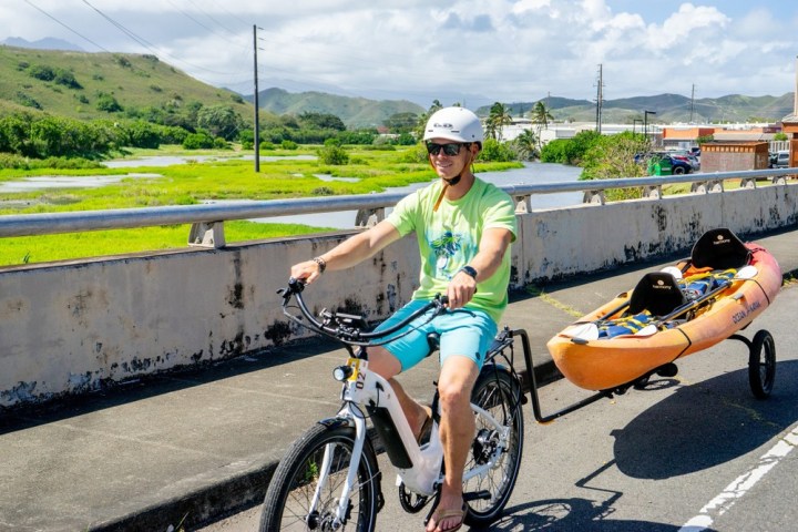 a person riding on the back of a bicycle
