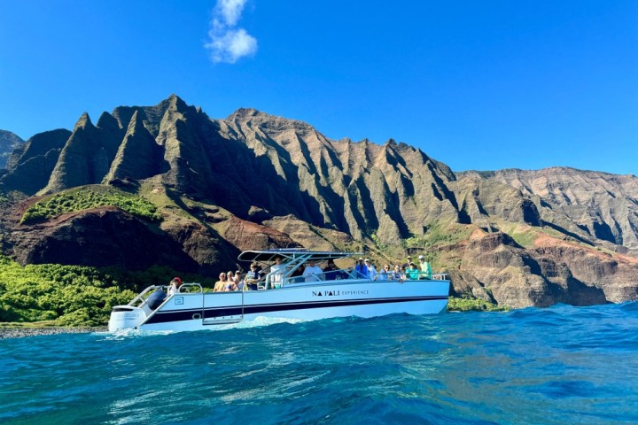 a body of water with a mountain in the background