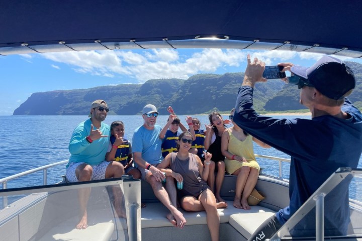 a group of people on a boat in the water