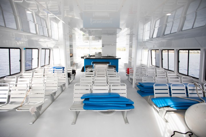 a table topped with a blue chair