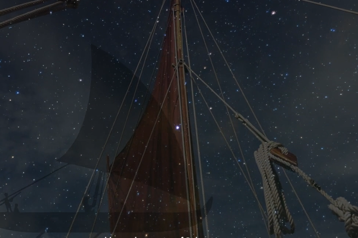 Sailboat mast and rigging against a starry night sky.